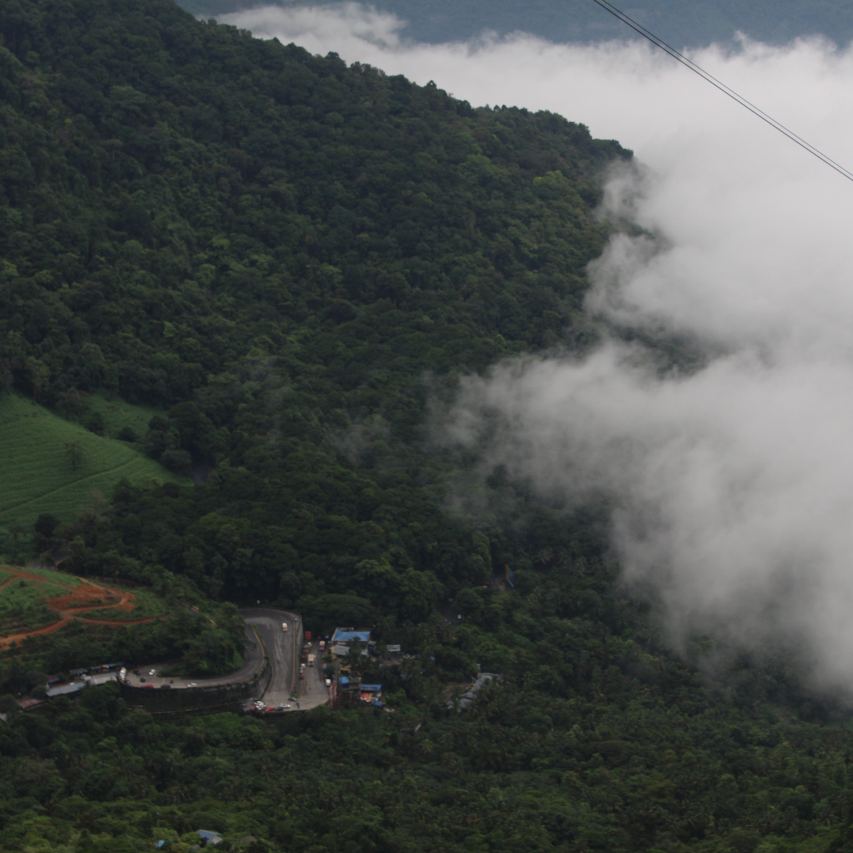 A misty green valley seen from above