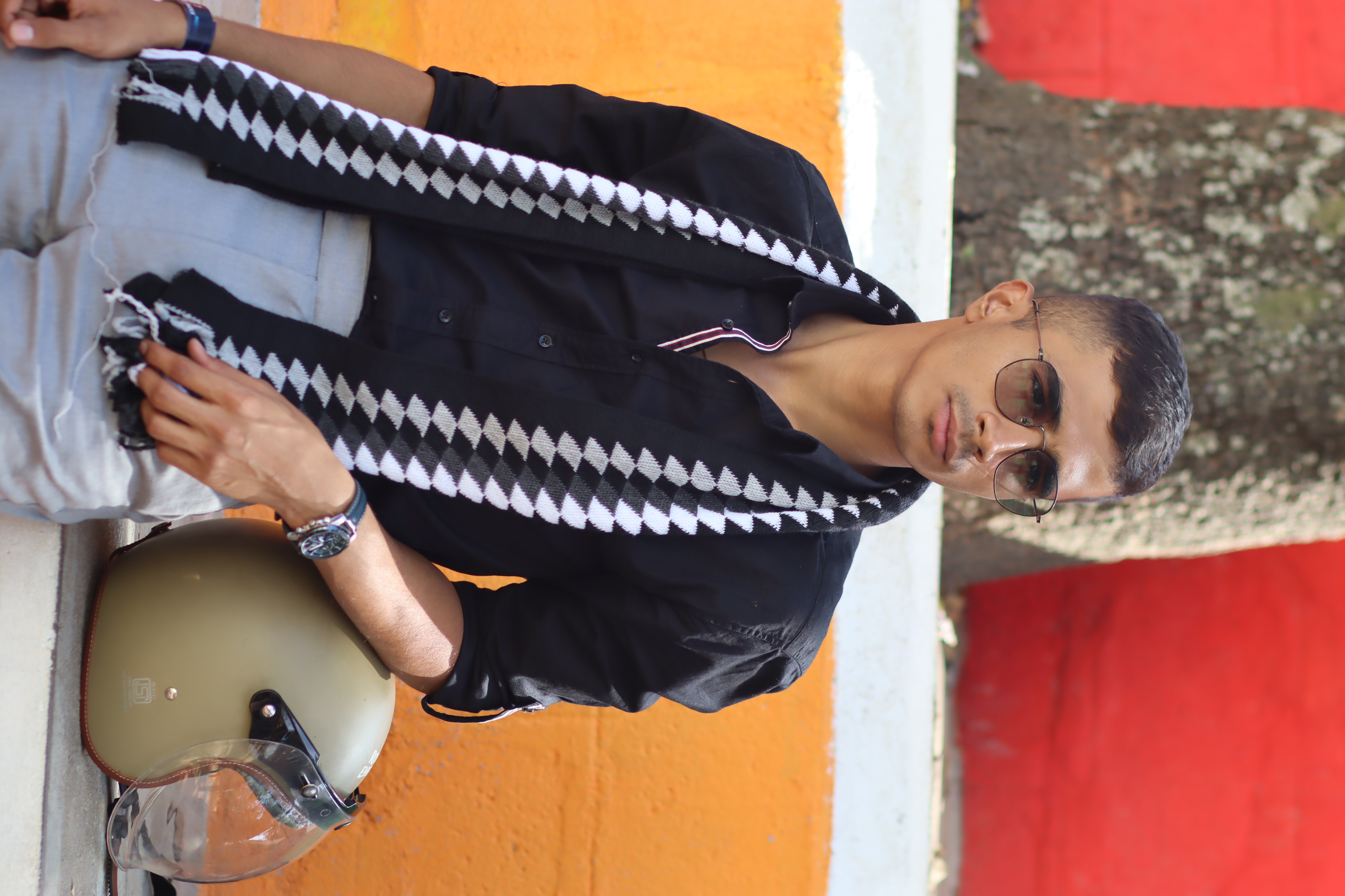A portrait against a brightly painted wall